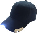 FRONT VIEW OF BASEBALL CAP WITH LED LIGHTS IN PEAK AND BOTTLE OPENER IN SIDE OF PEAK
